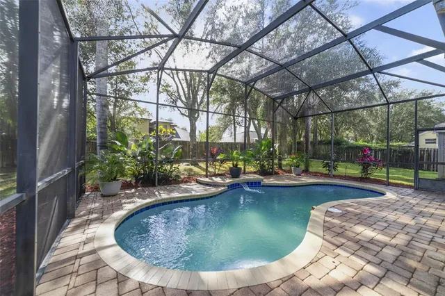 a view of a swimming pool with sitting area
