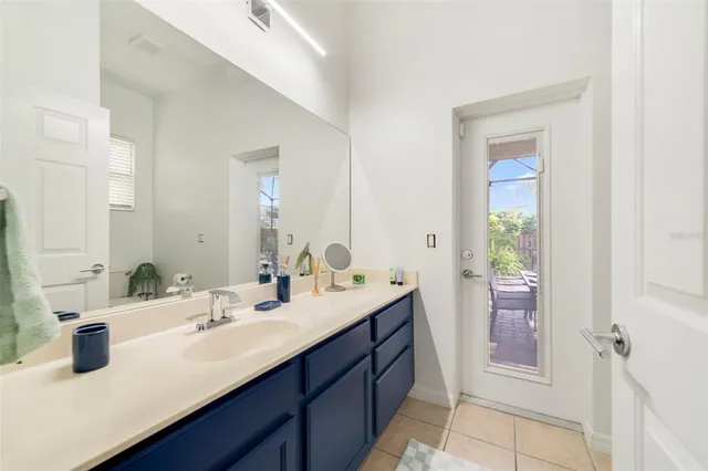 a bathroom with a sink double vanity and a mirror