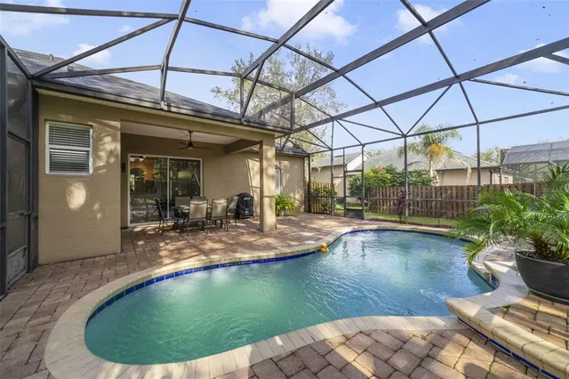 a view of a swimming pool with a patio