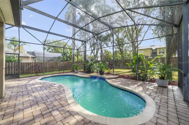 a view of a swimming pool with a patio