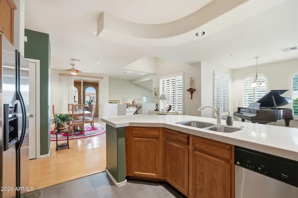 a kitchen with sink and refrigerator