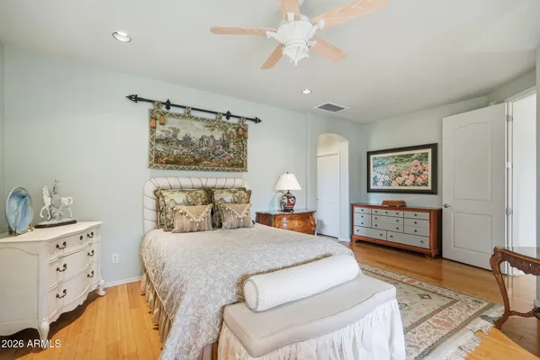 a bedroom with furniture and a window