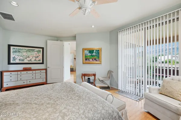 a bathroom with a granite countertop toilet a sink and mirror