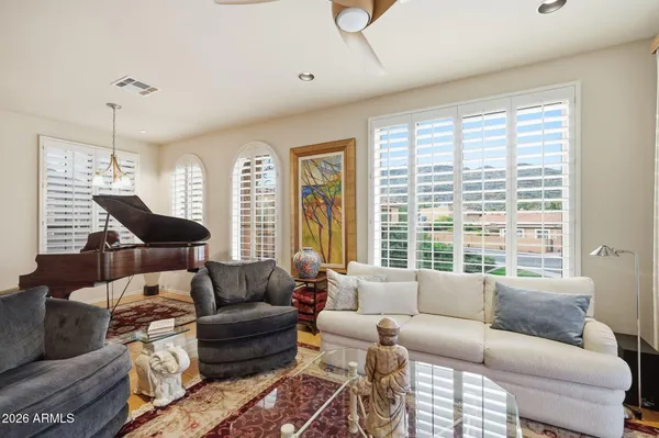 a living room with furniture and a large window