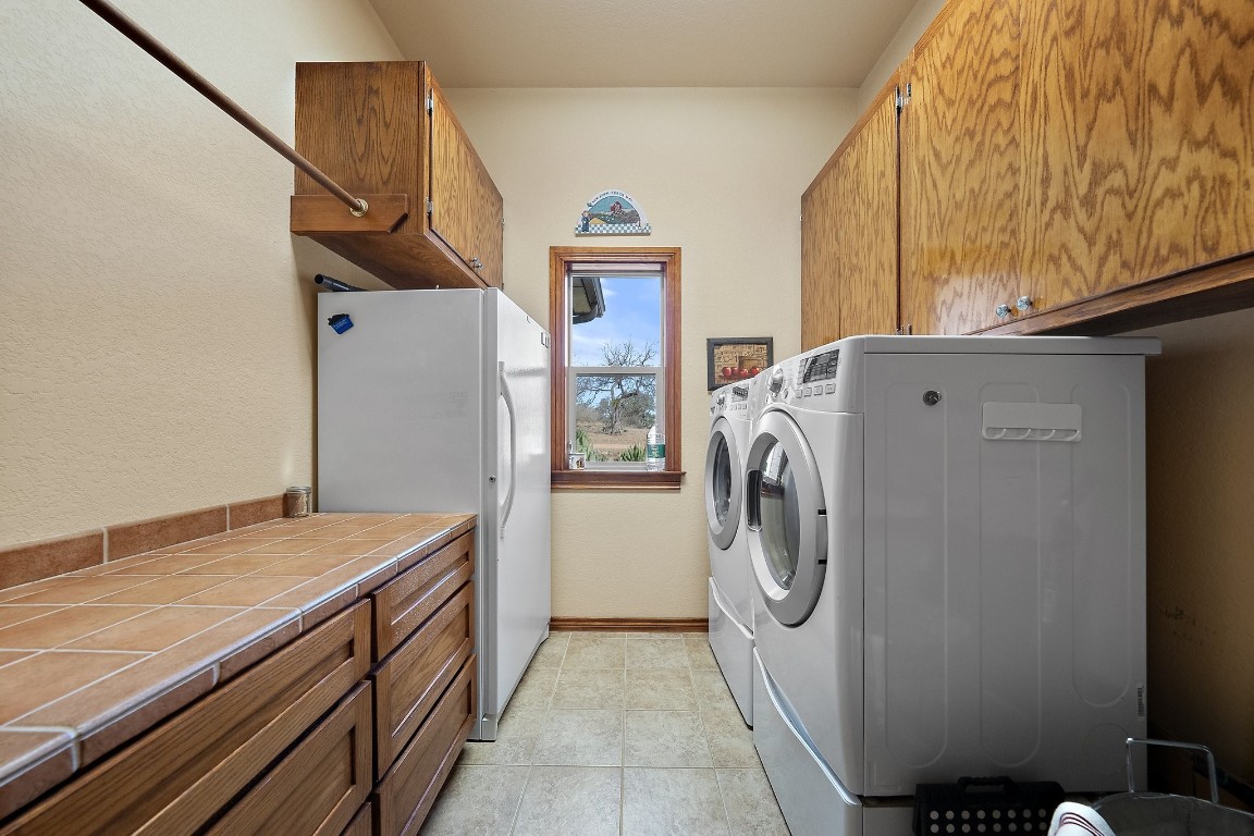 8095 Ranch To Market Road 2618 Fredonia, TX 76842 - Photo 12 of 39 a utility room with dryer and washer