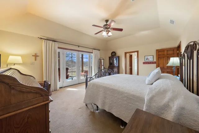 a kitchen with stainless steel appliances granite countertop a sink and a refrigerator