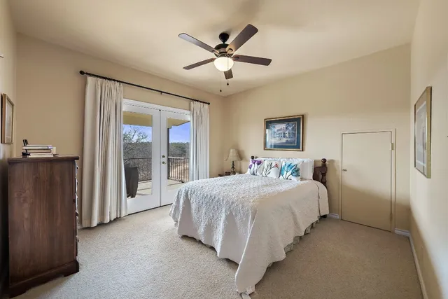 a bathroom with a granite countertop sink a large mirror and shower