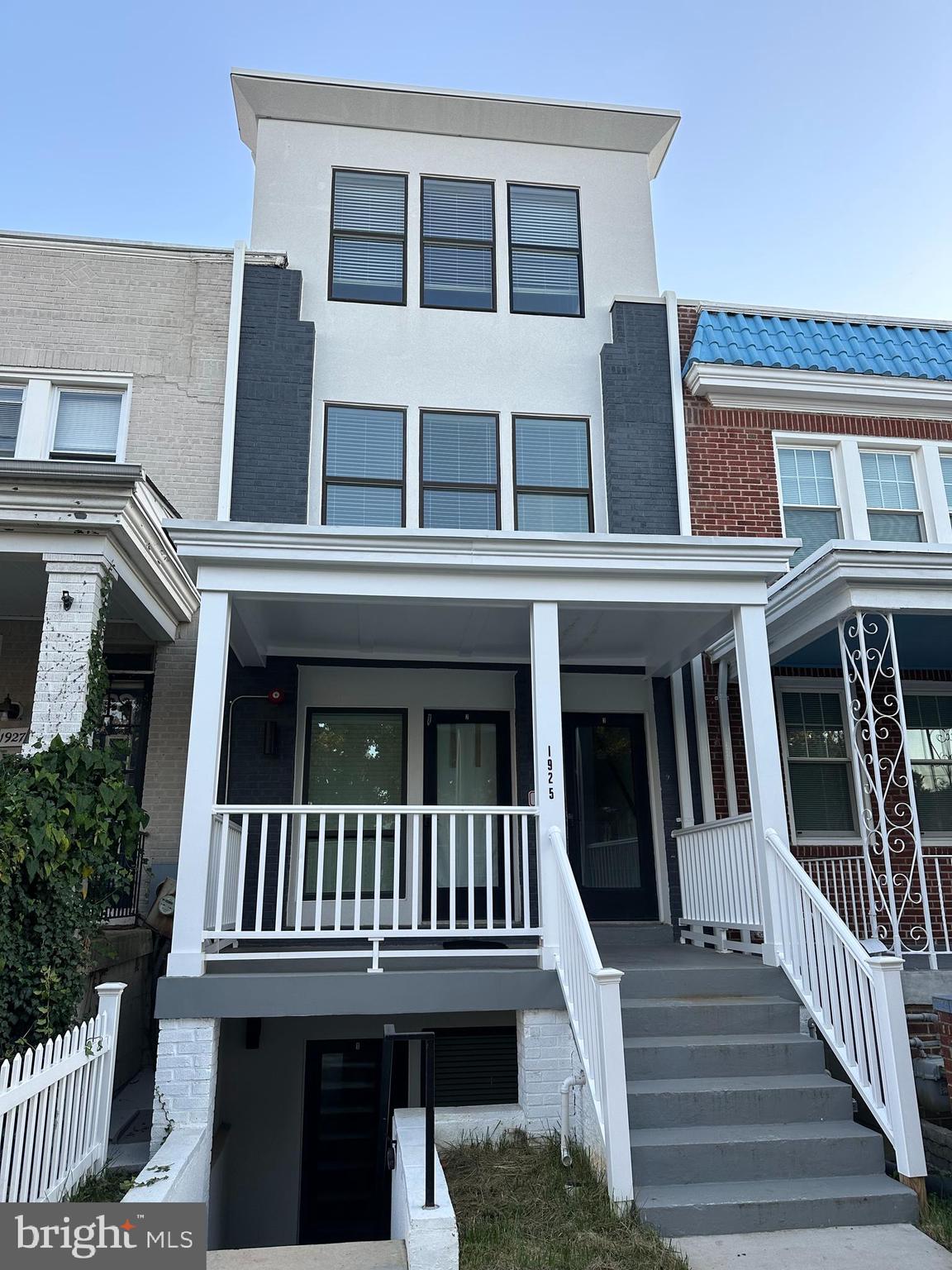 a view of a house with wooden deck