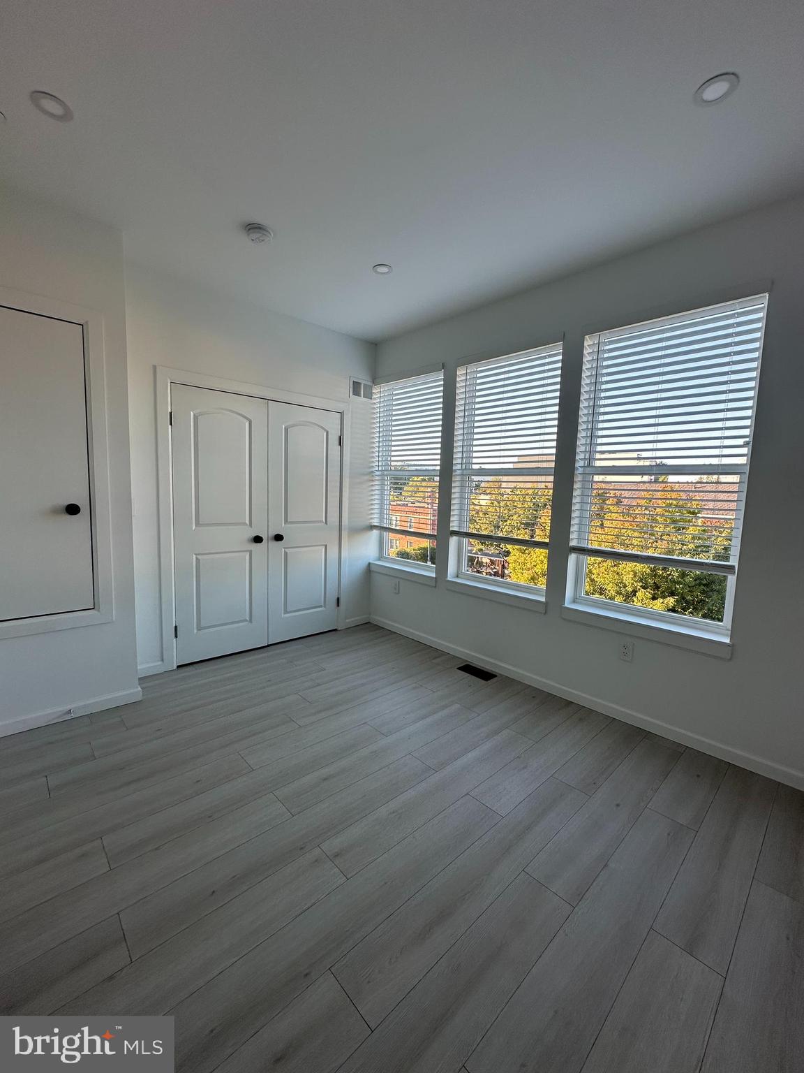 1925 H Street Northeast, Unit 3 Washington, DC 20002 - Photo 14 of 33 an empty room with large window