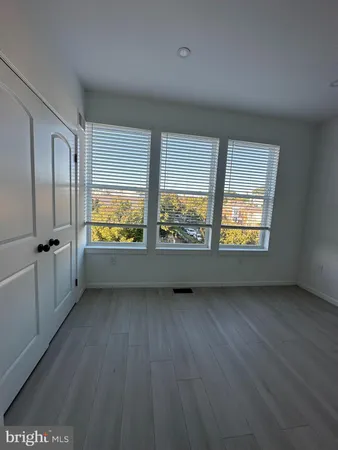 an empty room with large window