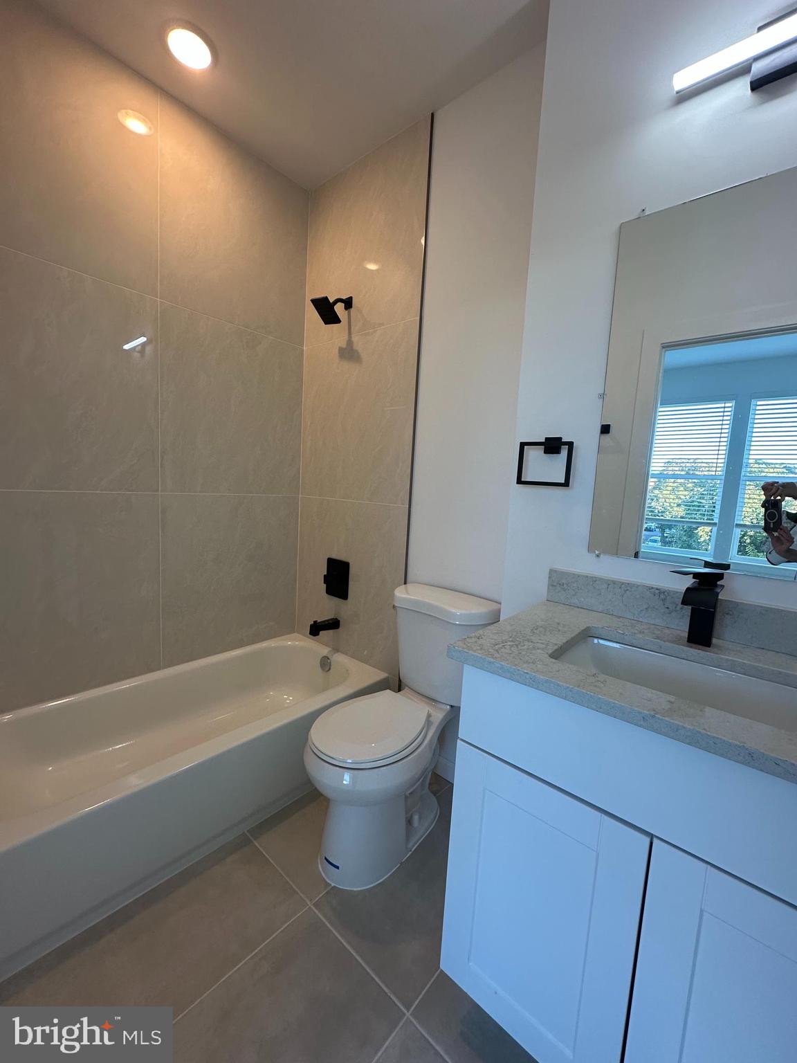 1925 H Street Northeast, Unit 3 Washington, DC 20002 - Photo 17 of 33 a bathroom with a toilet a sink and bathtub