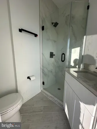 a bathroom with a toilet a sink and bathtub
