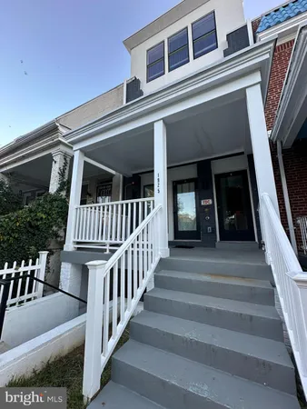 a view of staircase with large windows