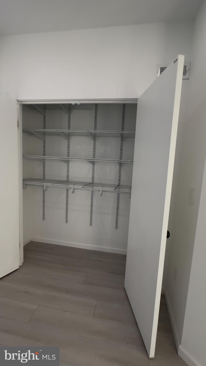 1925 H Street Northeast, Unit 3 Washington, DC 20002 - Photo 20 of 33 wooden floor in an empty room