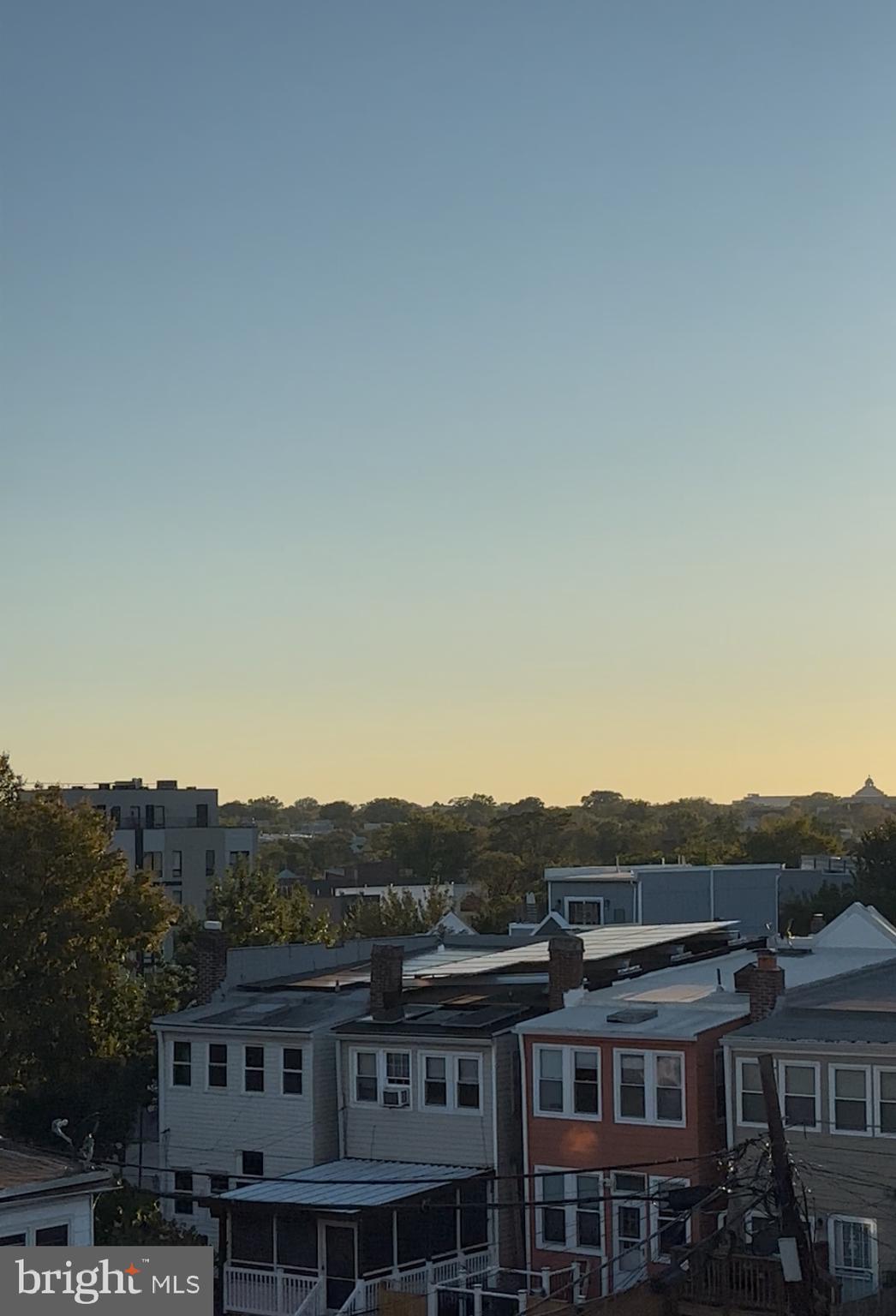 1925 H Street Northeast, Unit 3 Washington, DC 20002 - Photo 23 of 33 an aerial view of residential houses with a city view