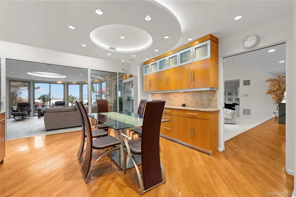 a view of a dining room with furniture and wooden floor