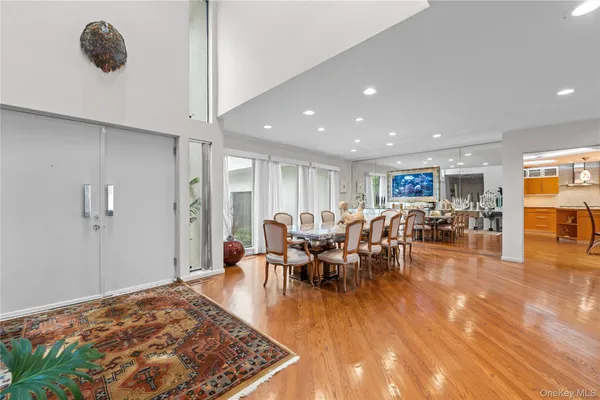 a living room with lots of furniture and wooden floor