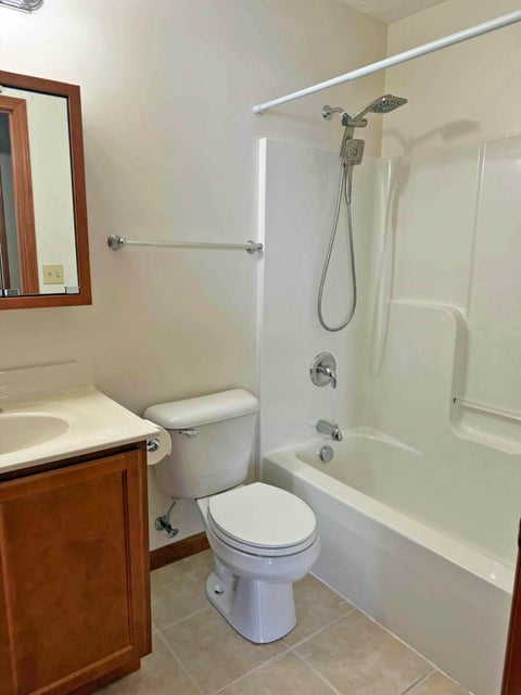 541 North Point Troy, OH 45373 - Photo 16 of 23 This clean and bright bathroom features a functional vanity and a combined shower-bathtub unit.