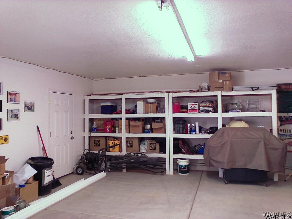3808 Hoover Road Golden Valley, AZ 86413 - Photo 18 of 28 Permanent shelvingMan door