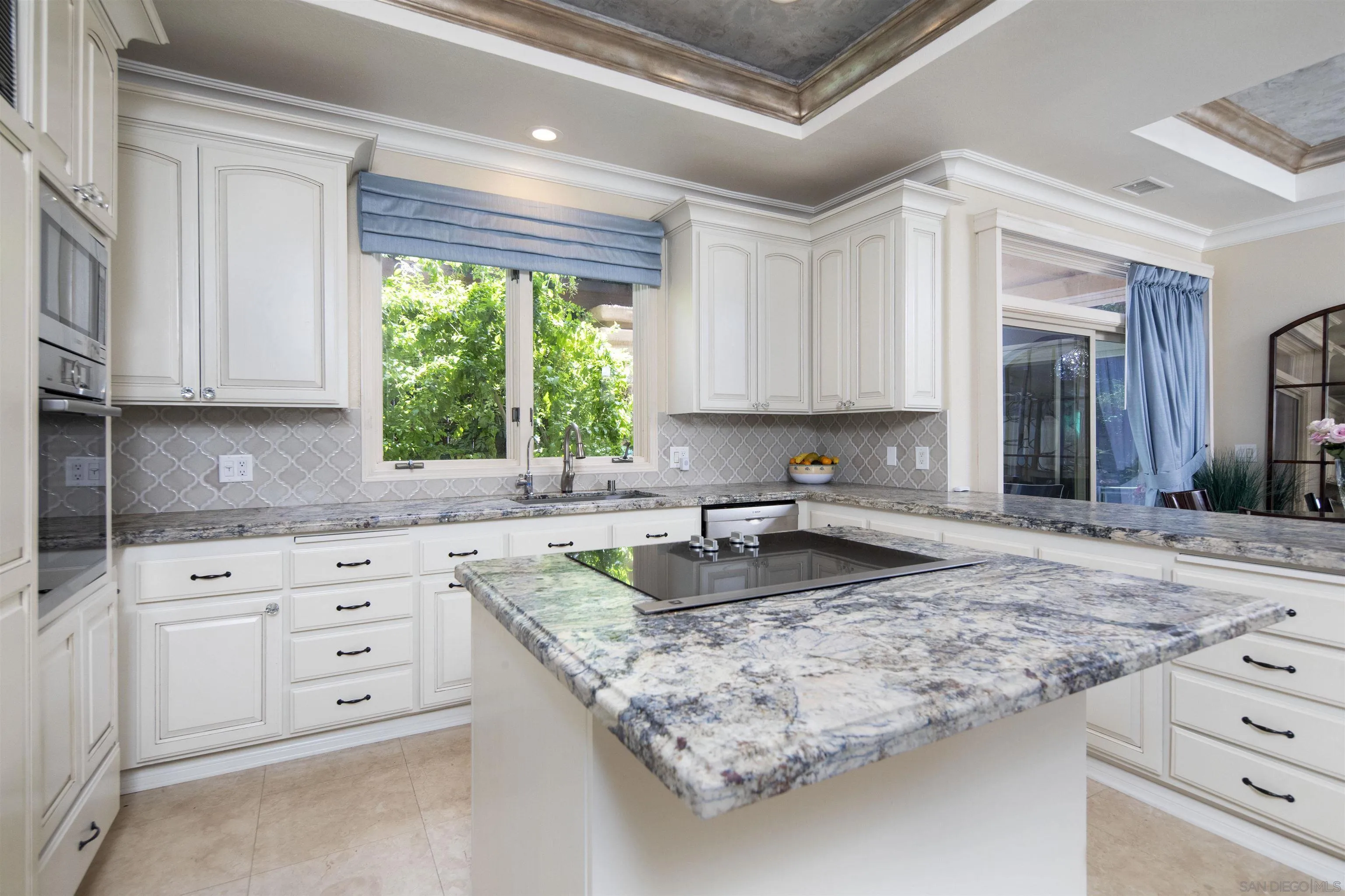 15448 Pimlico Corte Rancho Santa Fe, CA 92067 - Photo 17 of 31 a kitchen with granite countertop a sink window and cabinets