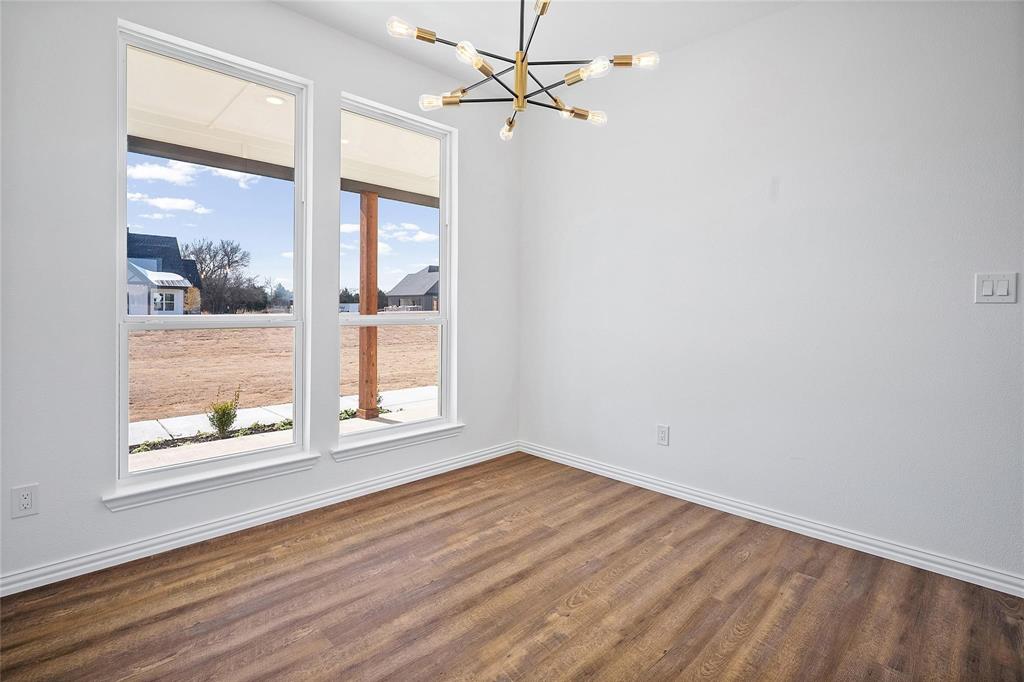 3093 Willow Road Celeste, TX 75423 - Photo 19 of 40 wooden floor in an empty room with a window