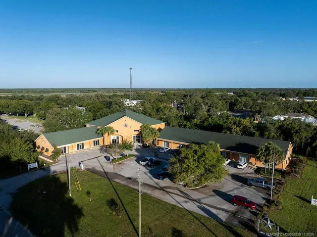 an aerial view of a house with a garden