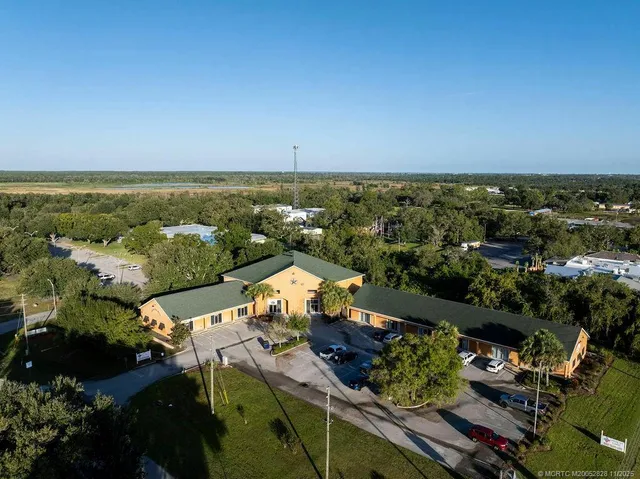 an aerial view of a house with a garden