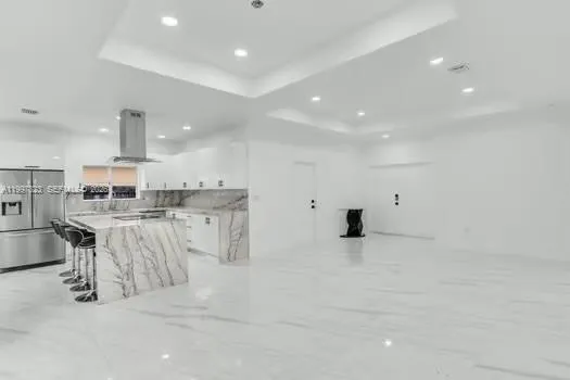 a view of kitchen with furniture and window