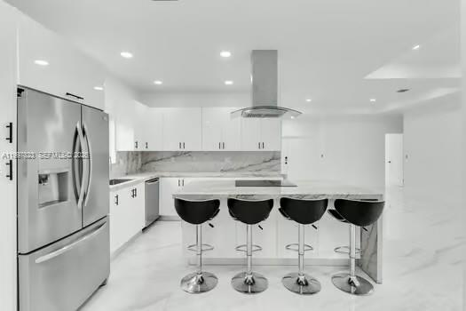 4127 Northeast 30th Street Homestead, FL 33033 - Photo 15 of 50 a kitchen with stainless steel appliances kitchen island granite countertop a sink and cabinets
