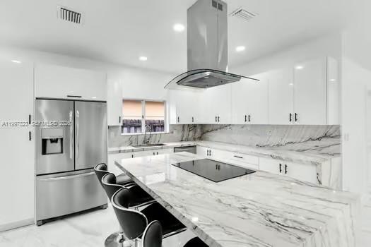 4127 Northeast 30th Street Homestead, FL 33033 - Photo 16 of 50 a kitchen with a center island appliances and cabinets