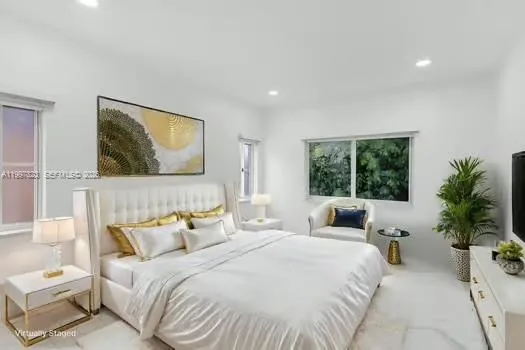 a bathroom with a granite countertop sink a toilet and a mirror
