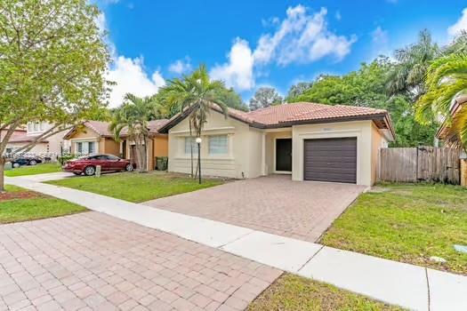4127 Northeast 30th Street Homestead, FL 33033 - Photo 2 of 50 a view of a house with a yard and large tree