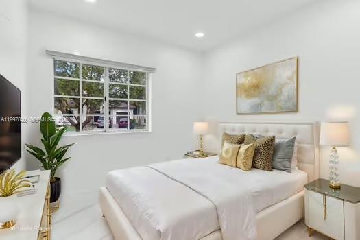 4127 Northeast 30th Street Homestead, FL 33033 - Photo 22 of 50 a bedroom with a bed and a potted plant
