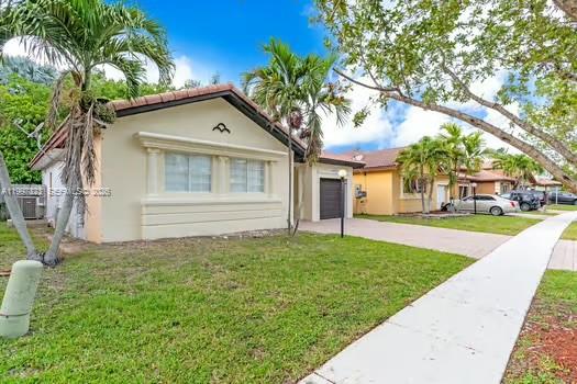 4127 Northeast 30th Street Homestead, FL 33033 - Photo 3 of 50 a house view with a garden space