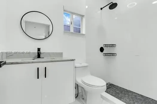 an aerial view of residential houses with outdoor space and river