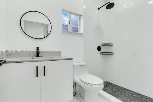 4127 Northeast 30th Street Homestead, FL 33033 - Photo 32 of 50 a bathroom with a toilet a sink and mirror