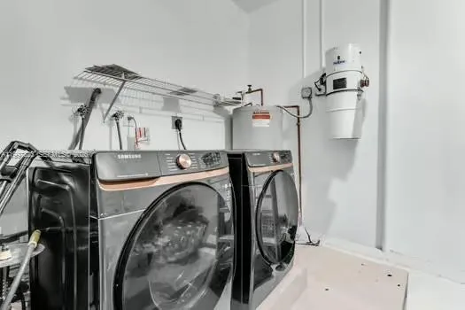a front view of a house with a garden and palm trees