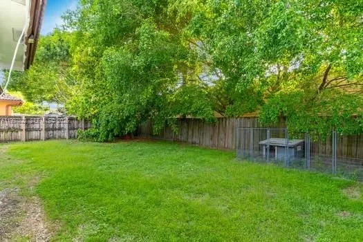 an aerial view of residential house with an outdoor space and seating