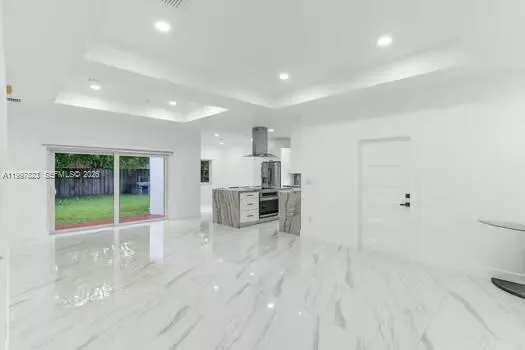 a kitchen with a sink cabinets and window
