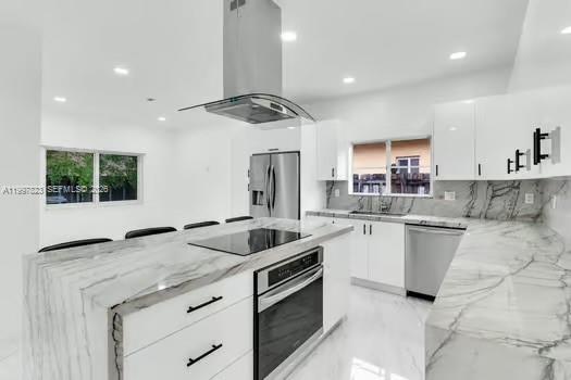 4127 Northeast 30th Street Homestead, FL 33033 - Photo 10 of 50 a kitchen with a sink cabinets and window