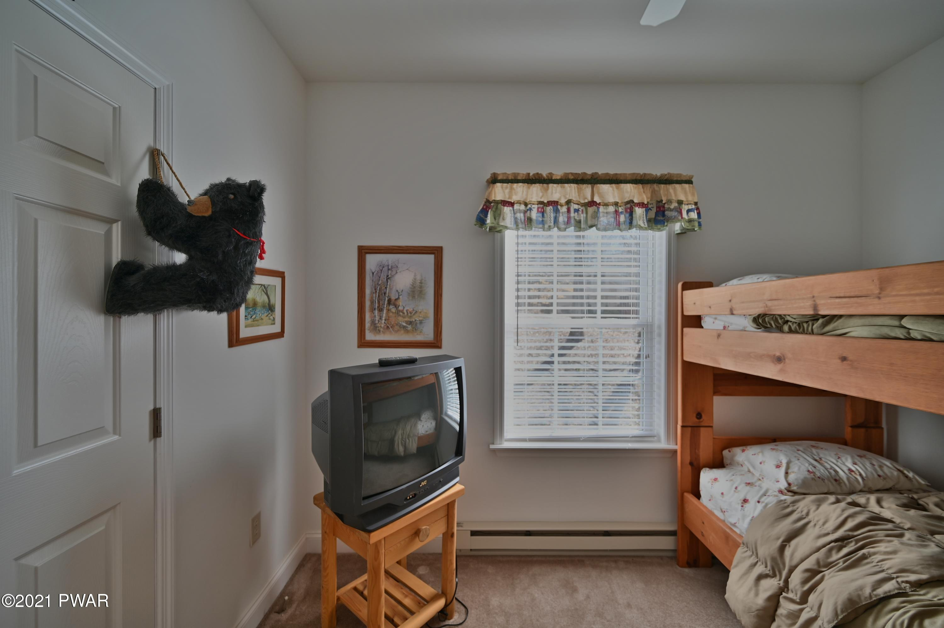 467 Northgate Road Lake Ariel, PA 18436 - Photo 23 of 46 a bedroom with a bed and cabinets