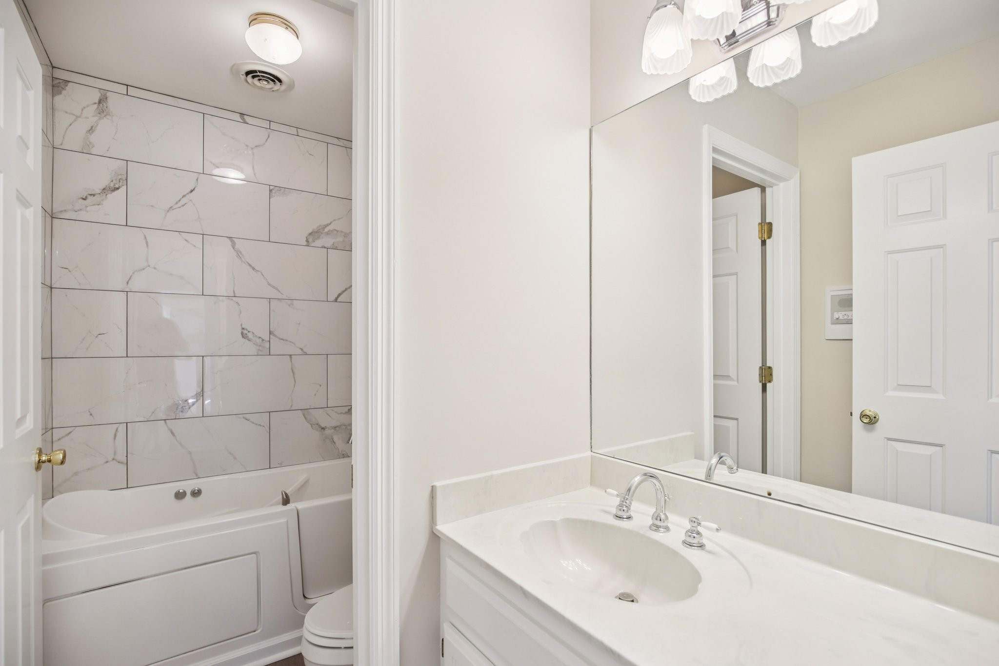 4026 Windland Drive Springfield, TN 37172 - Photo 13 of 32 a bathroom with a sink a toilet and shower