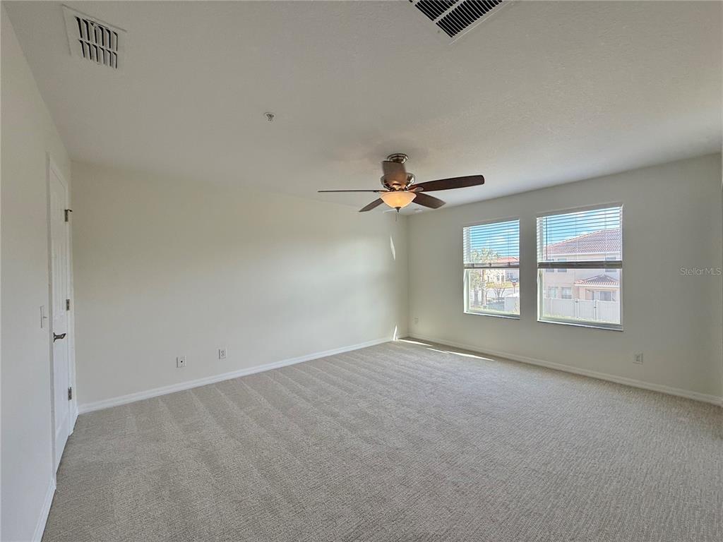 2090 Water Tupelo Way Ocoee, FL 34761 - Photo 14 of 43 a view of an empty room with a window