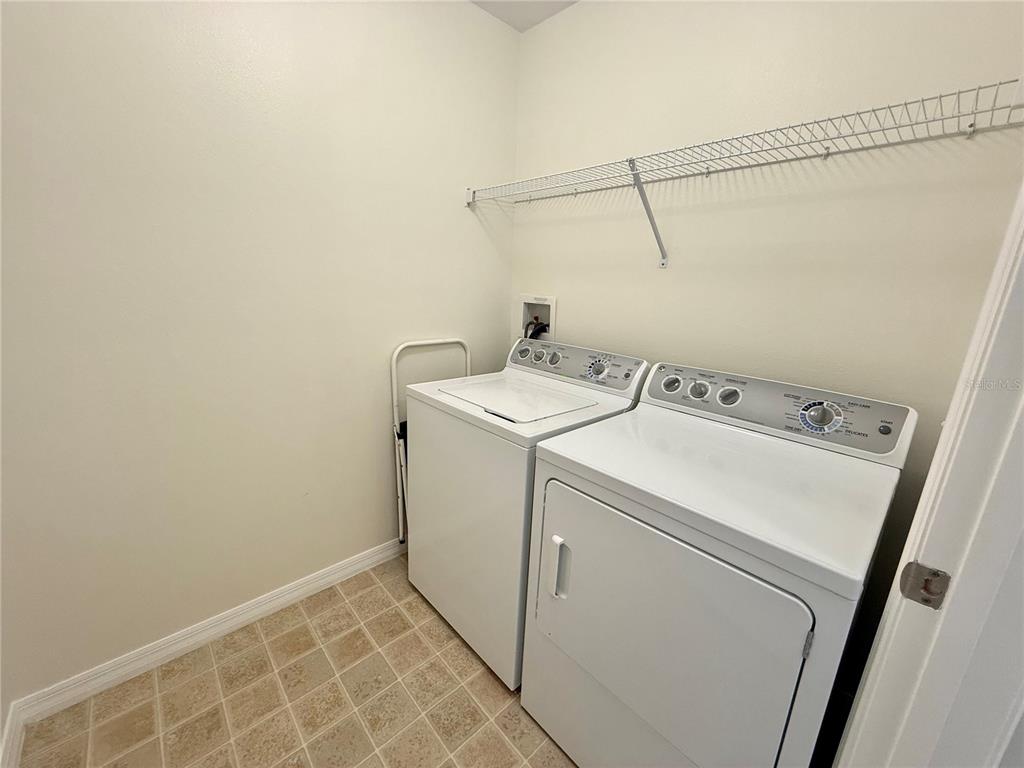 2090 Water Tupelo Way Ocoee, FL 34761 - Photo 24 of 43 a utility room with dryer and washer