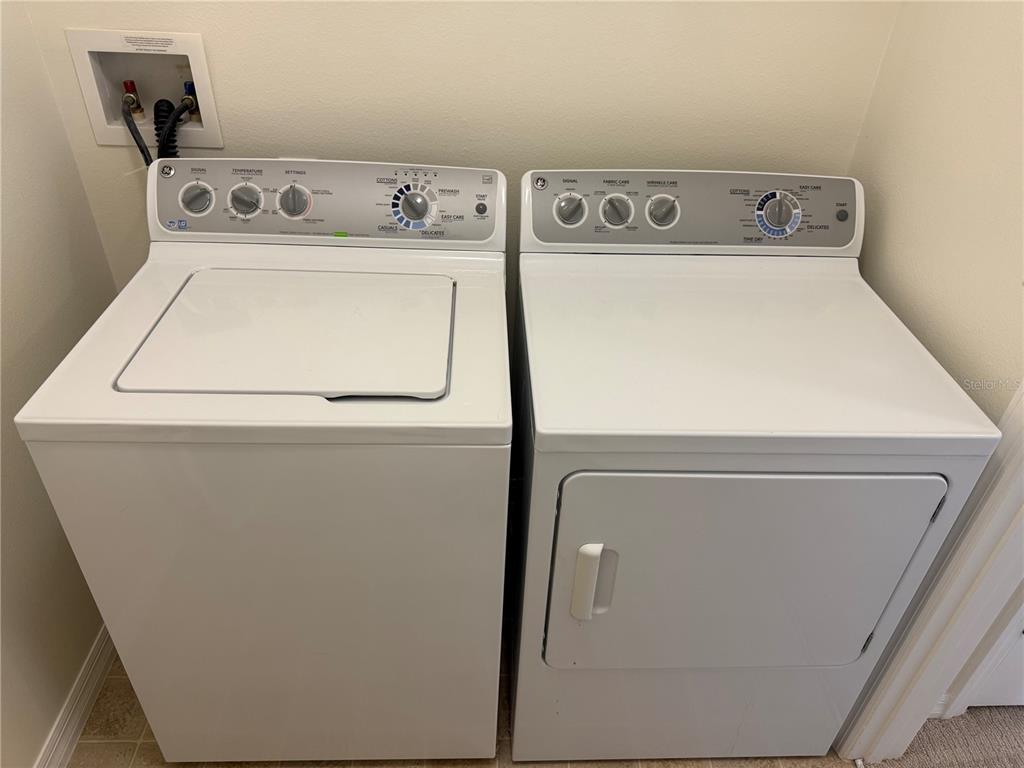 2090 Water Tupelo Way Ocoee, FL 34761 - Photo 25 of 43 a utility room with dryer and washer