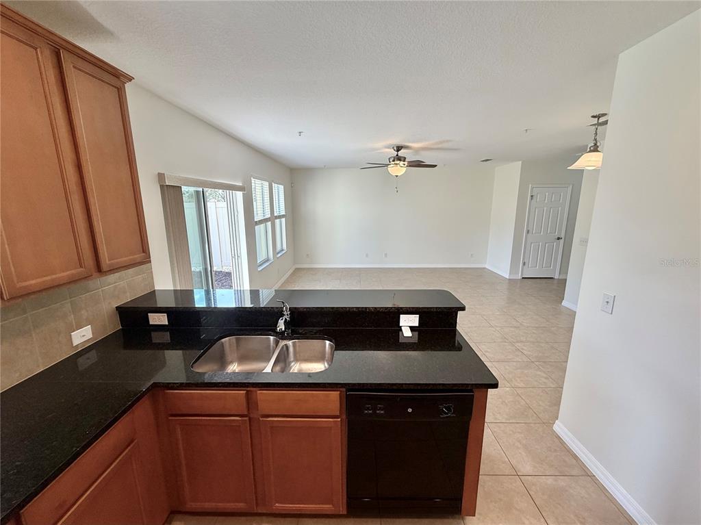2090 Water Tupelo Way Ocoee, FL 34761 - Photo 5 of 43 a kitchen with a sink and cabinets