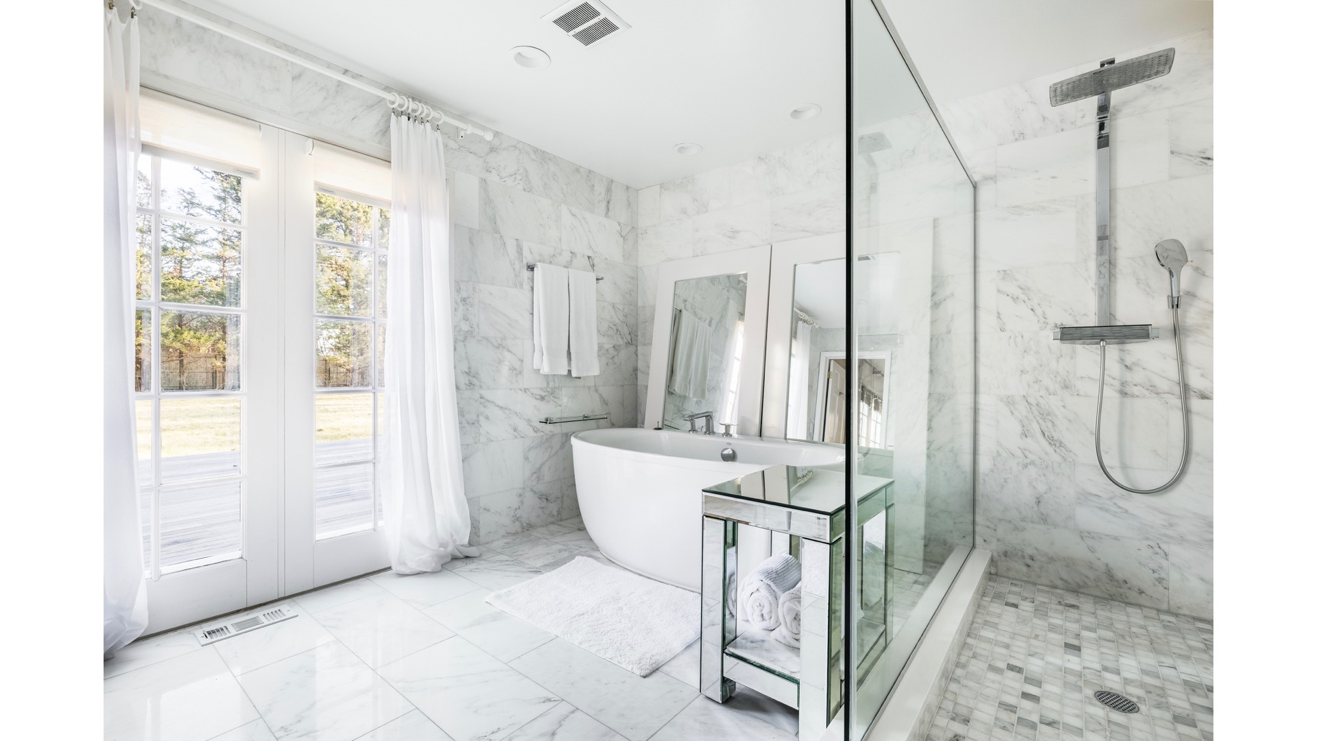 5 Ranch Court Sagaponack, NY 11962 - Photo 14 of 30 a bathroom with a granite countertop shower a mirror and a sink