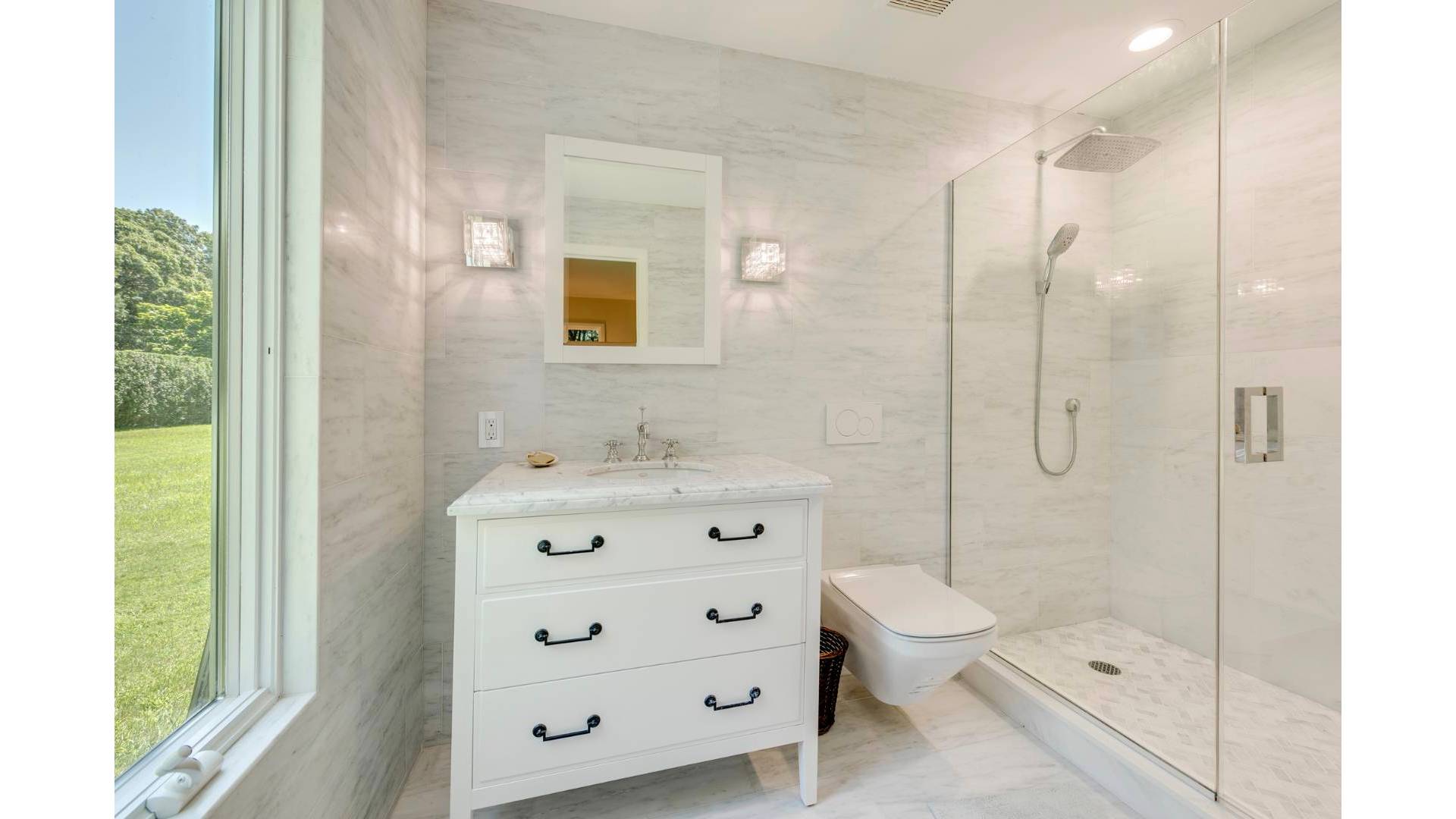 5 Ranch Court Sagaponack, NY 11962 - Photo 22 of 24 a bathroom with a double vanity sink toilet and shower