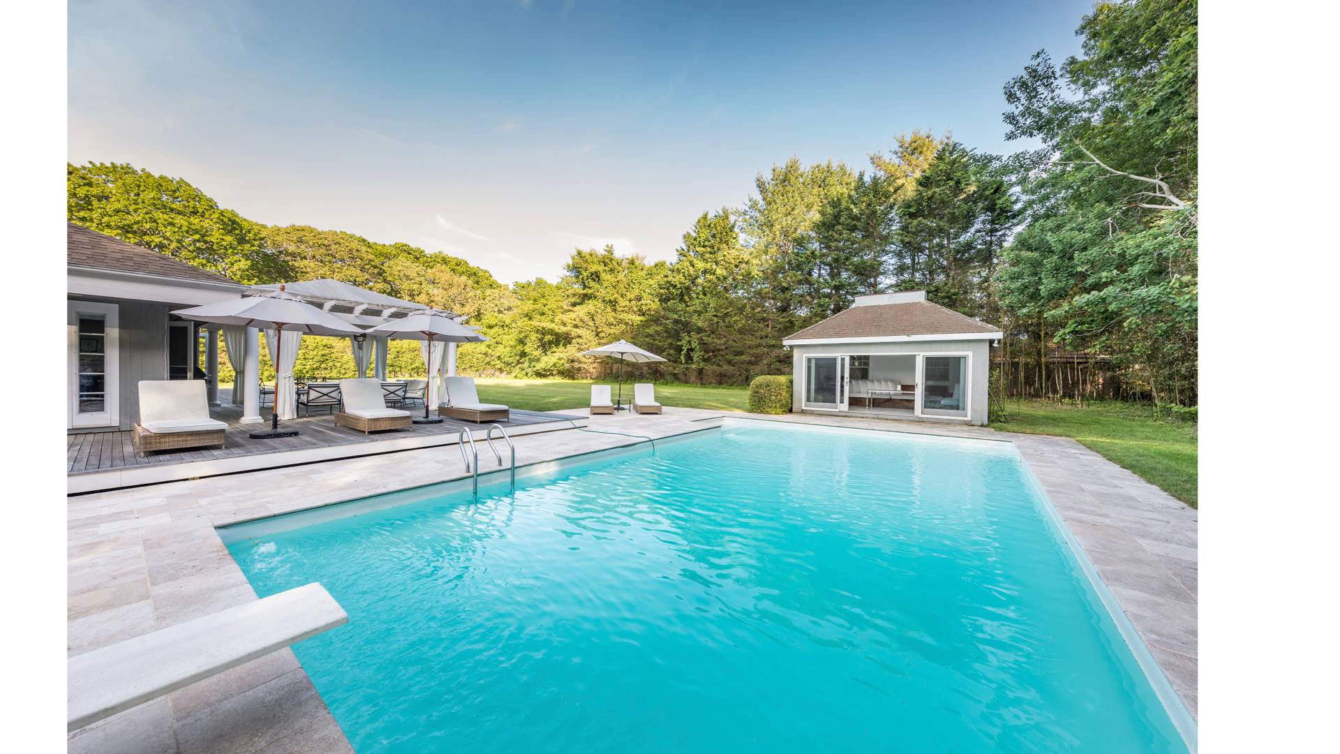 5 Ranch Court Sagaponack, NY 11962 - Photo 5 of 24 a swimming pool with outdoor seating and yard
