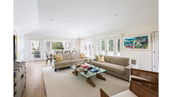 a bathroom with a granite countertop shower a mirror and a sink